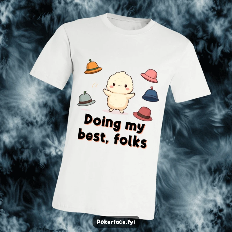Funny Juggling Creature T-Shirt: Small fluffy character blankly juggling falling hats, a funny depiction of managing life.
